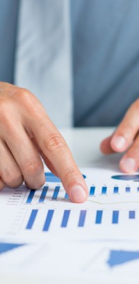 cc-img Reviewing a bar graph. McCanliss & Early corporate and commercial practice.